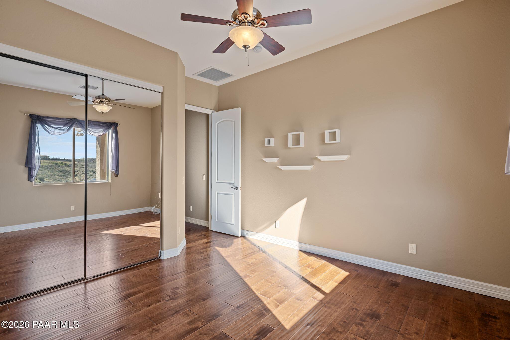 15411 East Rough Rider Ridge Mayer, AZ 86333 - Photo 38 of 57 a view of livingroom with hardwood floor and ceiling fan