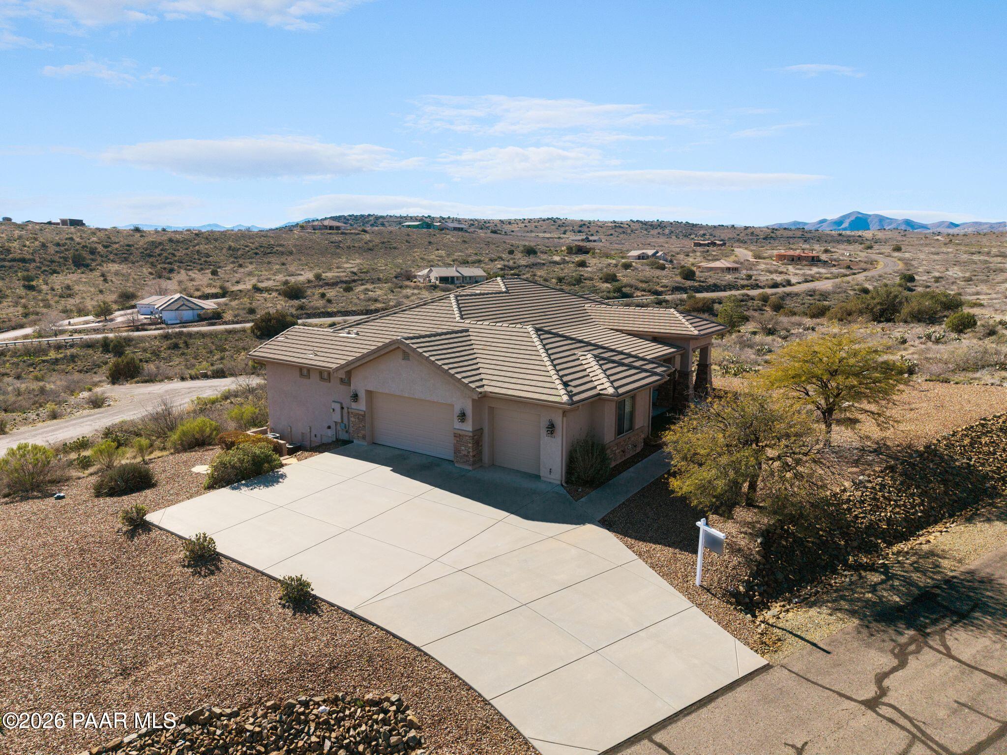 15411 East Rough Rider Ridge Mayer, AZ 86333 - Photo 50 of 57 an aerial view of a house with a yard
