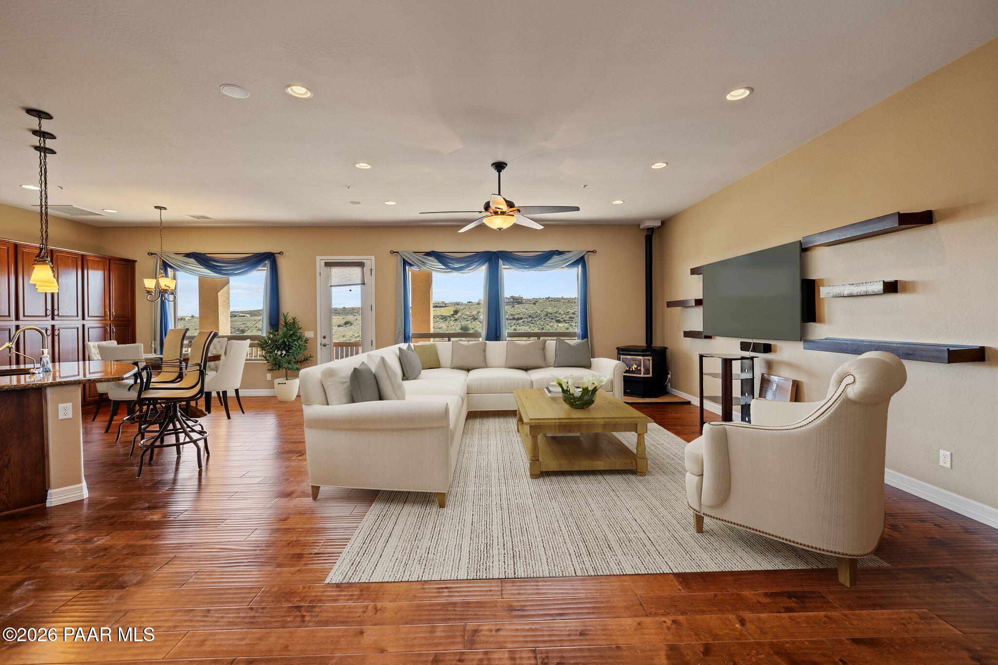 15411 East Rough Rider Ridge Mayer, AZ 86333 - Photo 8 of 57 a living room with furniture large window and flat screen tv