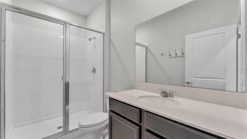 244 Pershing Street Bartow, FL 33830 - Photo 23 of 32 a bathroom with a sink a toilet and shower