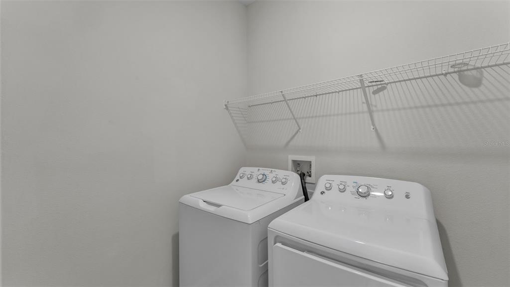 244 Pershing Street Bartow, FL 33830 - Photo 27 of 32 a utility room with dryer and washer