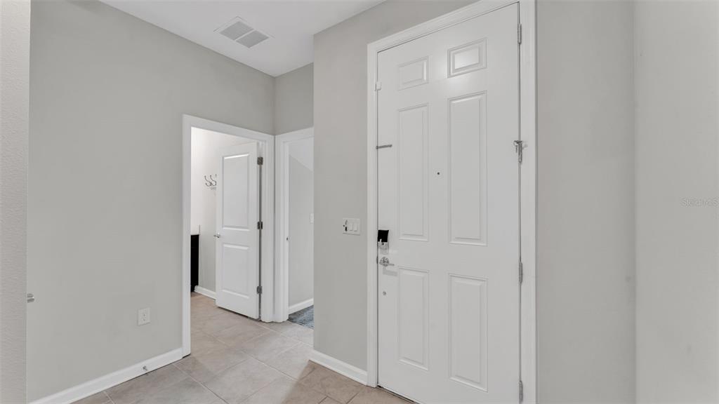 244 Pershing Street Bartow, FL 33830 - Photo 6 of 32 a view of a hallway with closet area