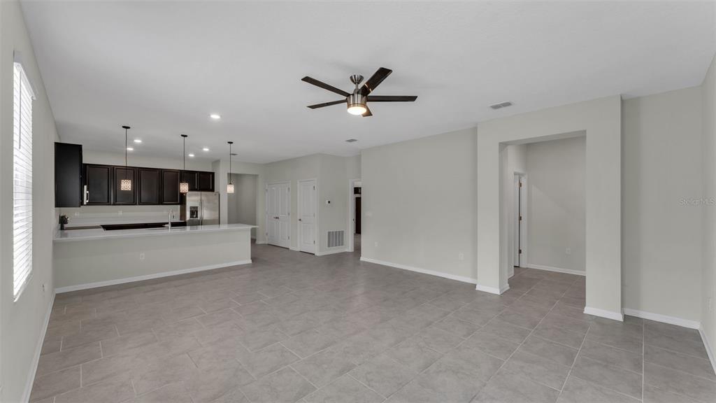 244 Pershing Street Bartow, FL 33830 - Photo 8 of 32 a view of a livingroom with a ceiling fan