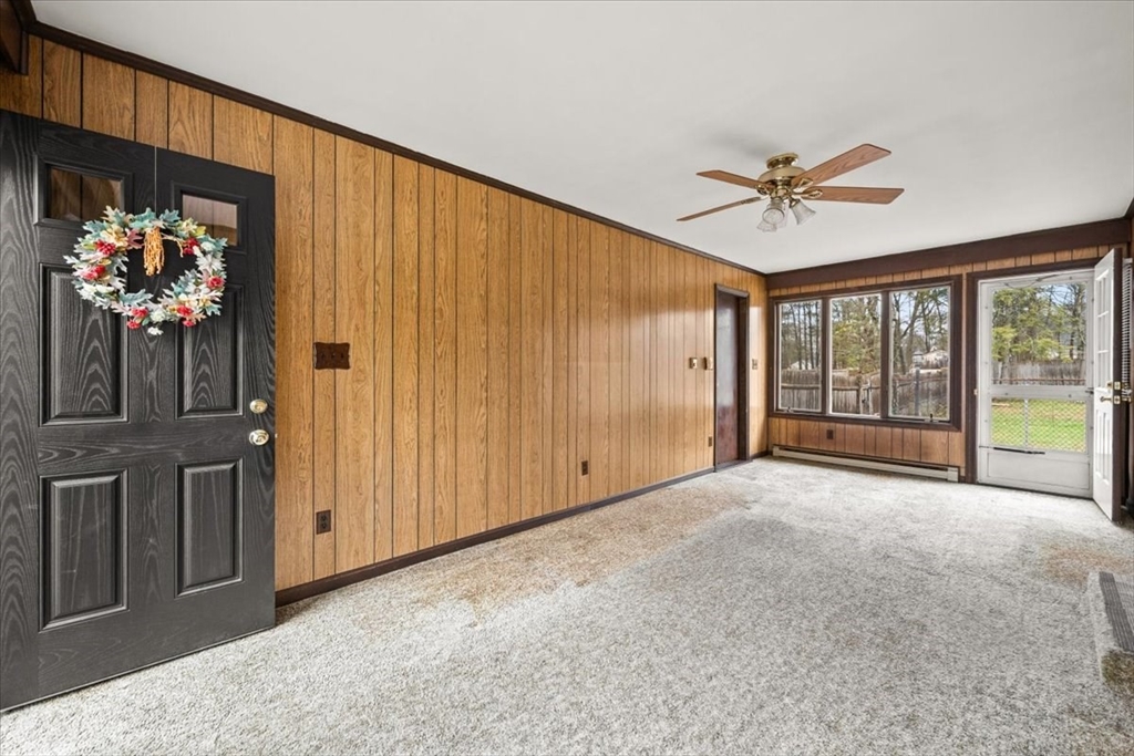 37 Woodlock Road Hingham, MA 02043 - Photo 16 of 34 a living room with furniture and a chandelier