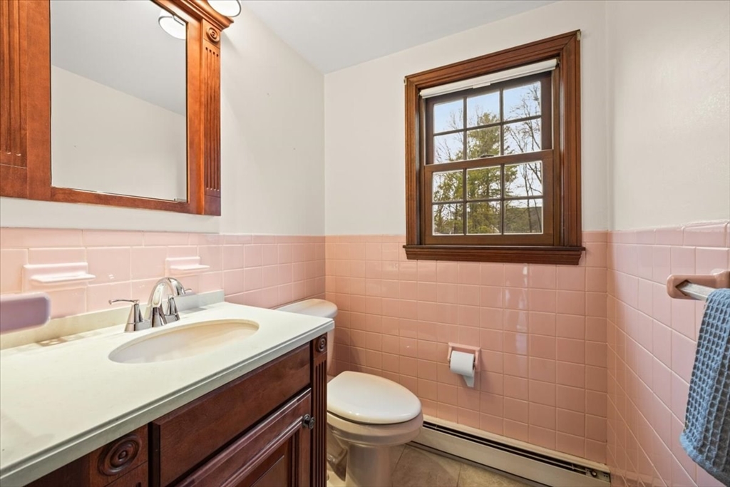37 Woodlock Road Hingham, MA 02043 - Photo 19 of 34 a bathroom with a sink toilet and a mirror
