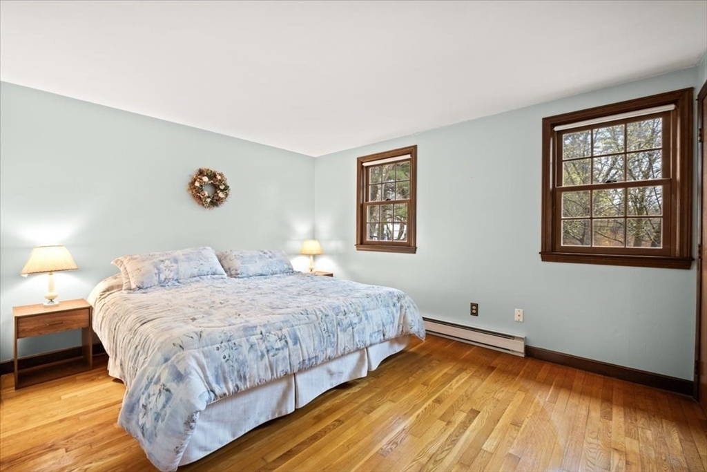 37 Woodlock Road Hingham, MA 02043 - Photo 21 of 34 a bedroom with a bed and a window