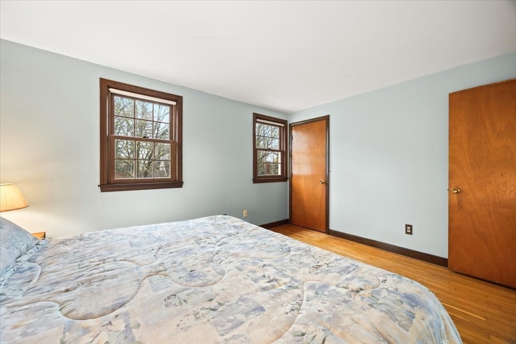 37 Woodlock Road Hingham, MA 02043 - Photo 22 of 34 a bedroom with a bed and a window