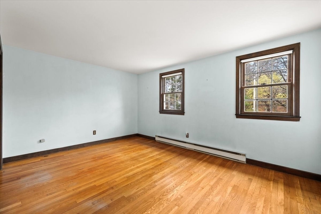 37 Woodlock Road Hingham, MA 02043 - Photo 25 of 34 a view of a room with wooden floor and a window