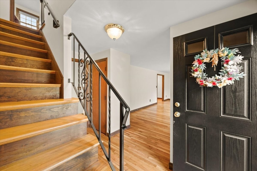 37 Woodlock Road Hingham, MA 02043 - Photo 6 of 34 a view of staircase with wooden floor and a potted plant