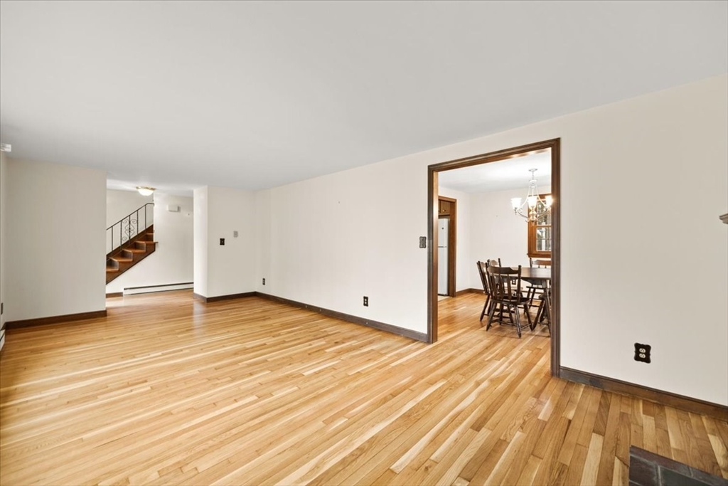 37 Woodlock Road Hingham, MA 02043 - Photo 10 of 34 a view of a livingroom with wooden floor and a sink