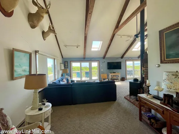 a living room with furniture fireplace and flat screen tv