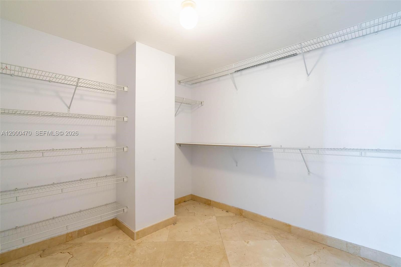 7350 Southwest 89th Street, Unit 1707S Miami, FL 33156 - Photo 15 of 45 a view of walk in closet with empty racks