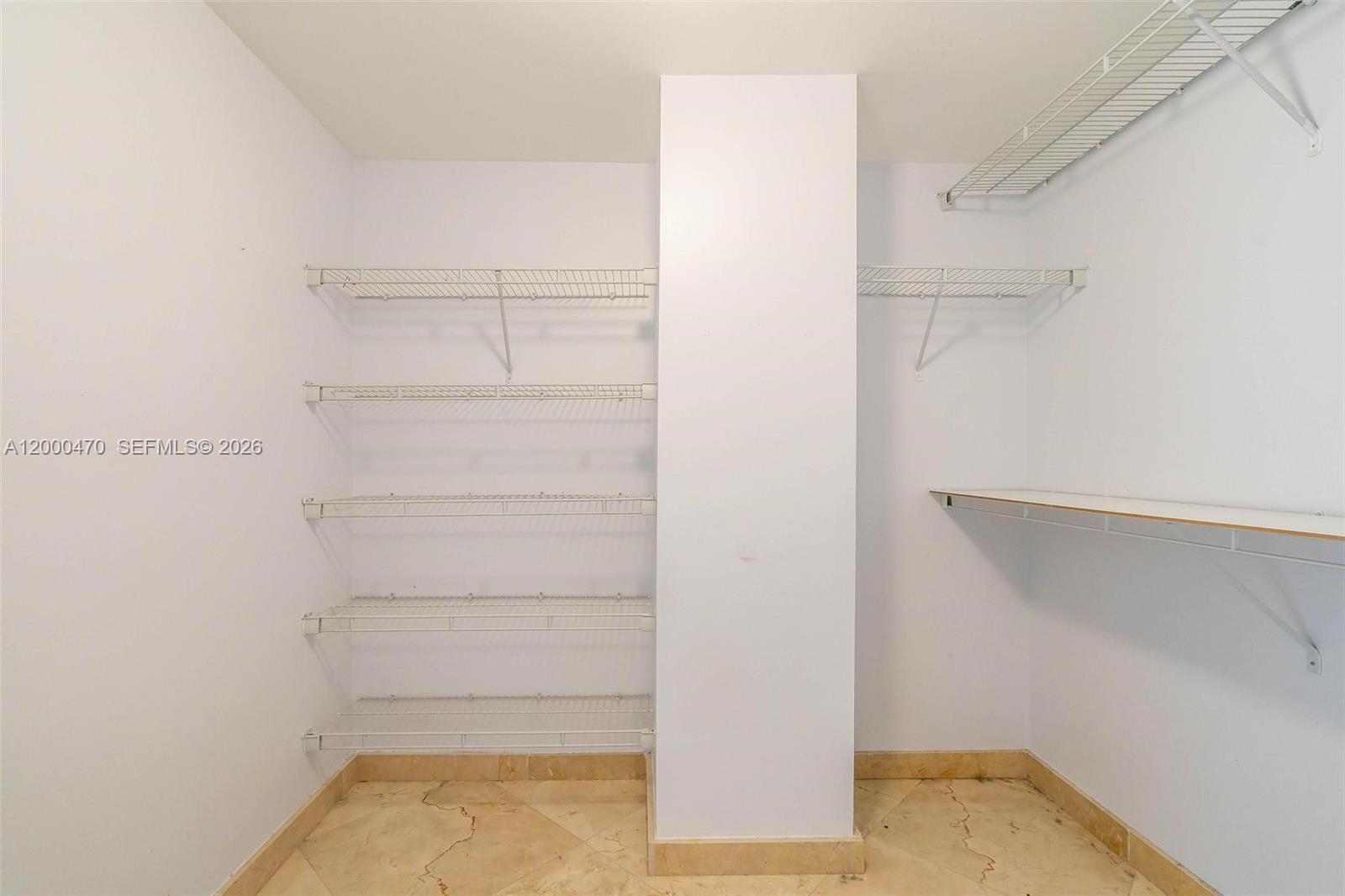 7350 Southwest 89th Street, Unit 1707S Miami, FL 33156 - Photo 16 of 45 a view of walk in closet with empty racks