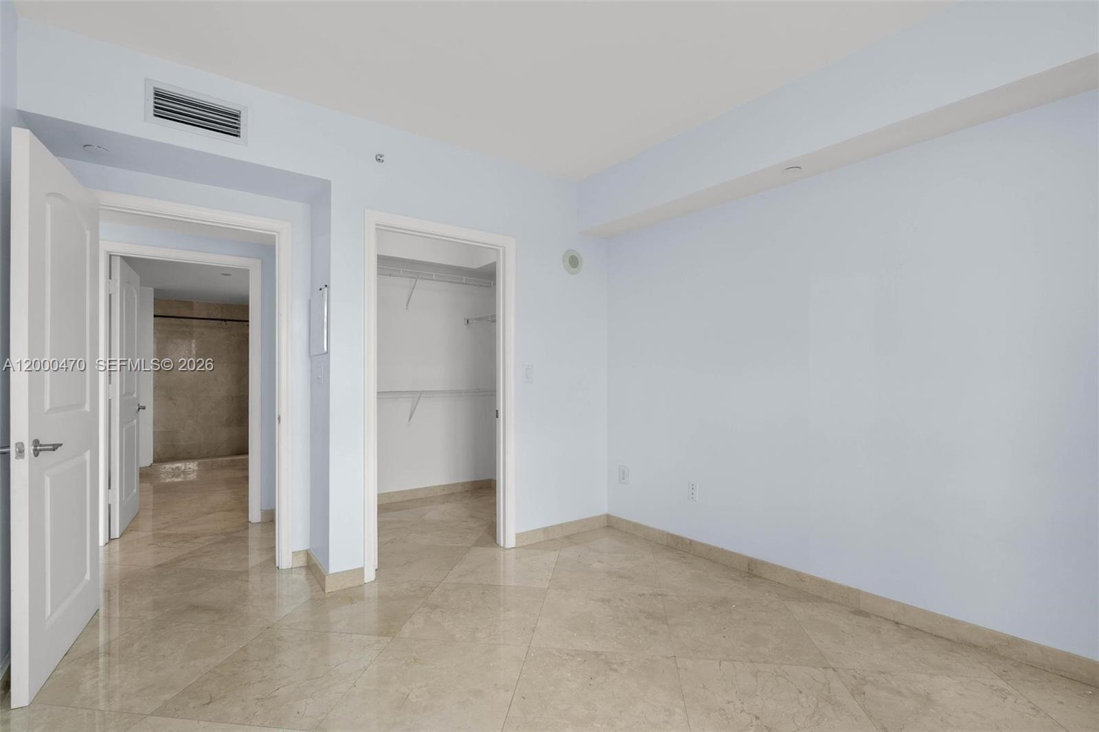 7350 Southwest 89th Street, Unit 1707S Miami, FL 33156 - Photo 18 of 45 an empty room with a bathroom