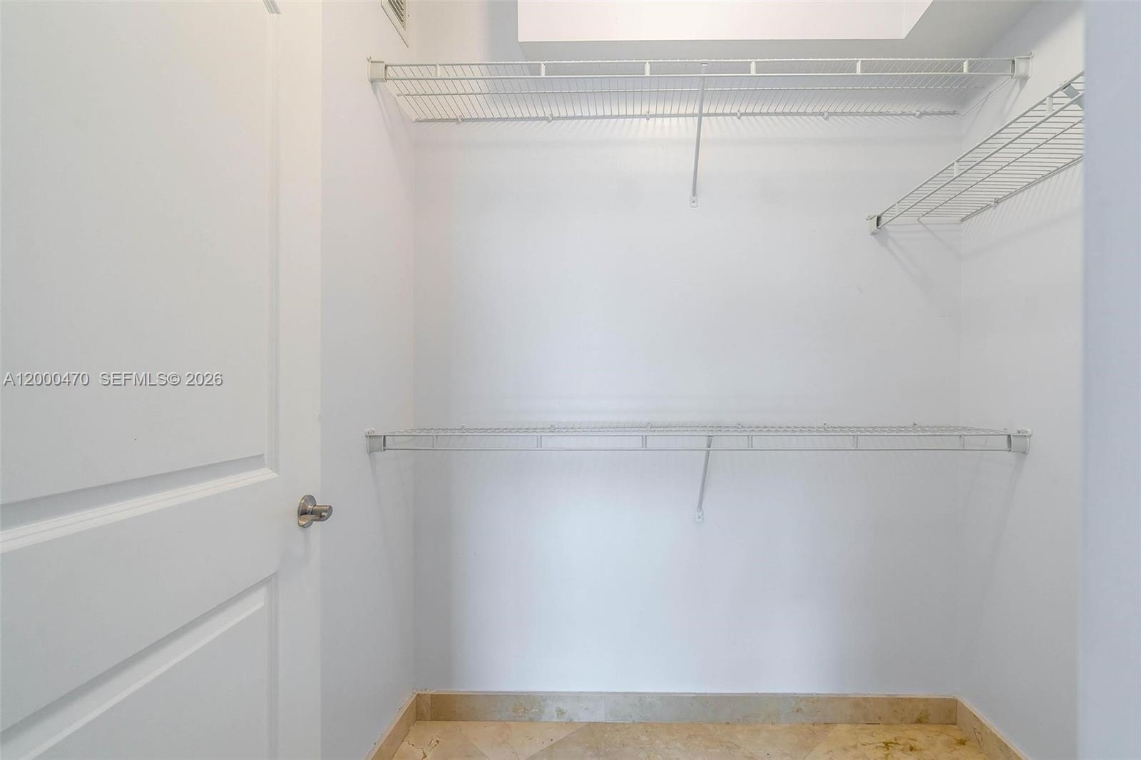 7350 Southwest 89th Street, Unit 1707S Miami, FL 33156 - Photo 21 of 45 a view of a room with racks on the wall