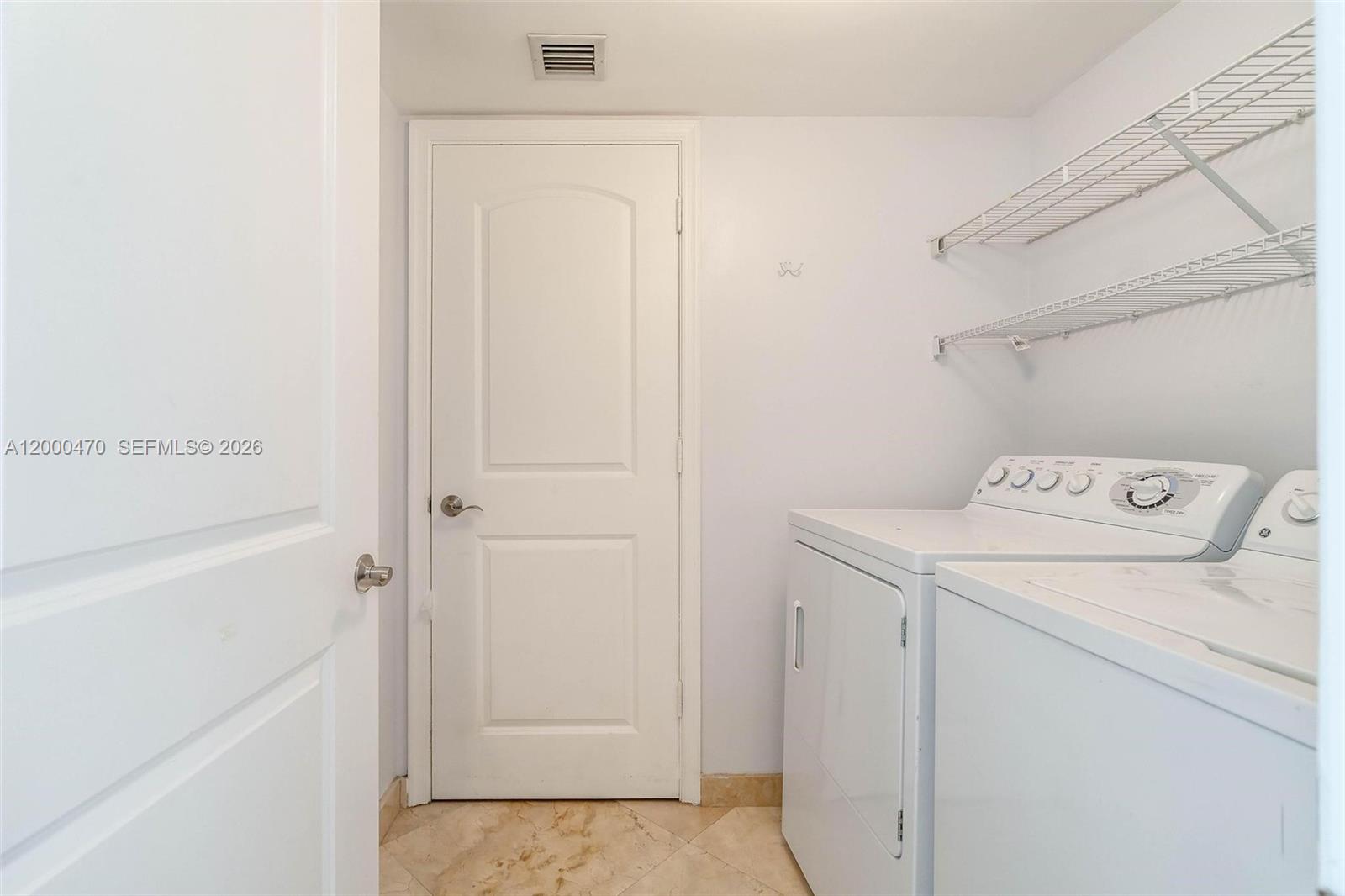 7350 Southwest 89th Street, Unit 1707S Miami, FL 33156 - Photo 40 of 45 a utility room with dryer and washer