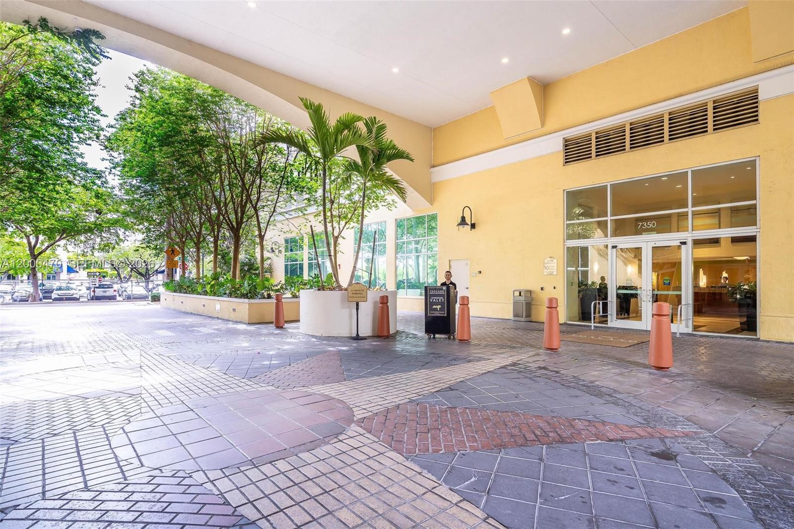 7350 Southwest 89th Street, Unit 1707S Miami, FL 33156 - Photo 5 of 45 a view of a building with an outdoor space