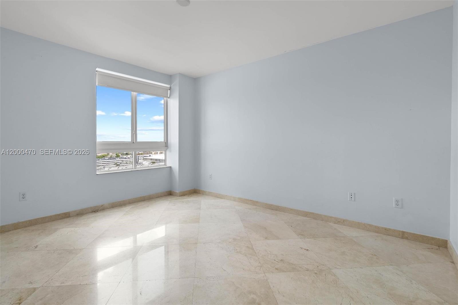 7350 Southwest 89th Street, Unit 1707S Miami, FL 33156 - Photo 9 of 45 a view of an empty room with a window