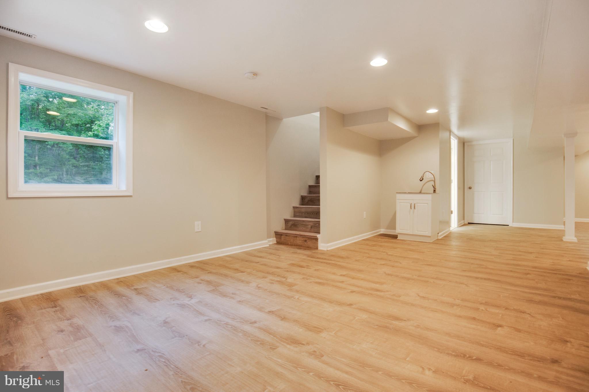 75 Hidden Spring Trail Prince Frederick, MD 20678 - Photo 22 of 29 a view of empty room with wooden floor and window