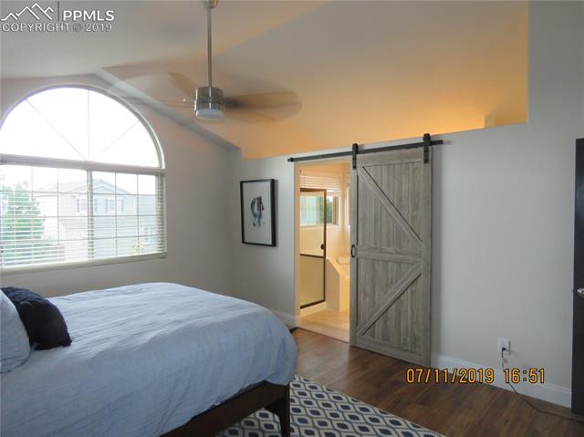 7799 Julynn Road Colorado Springs, CO 80919 - Photo 17 of 27 Barn door for privacy.