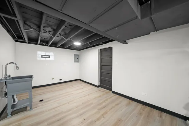 a view of a room with wooden floor