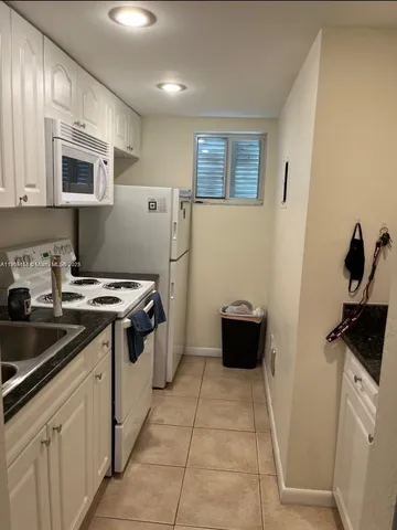 a kitchen with a stove and a microwave
