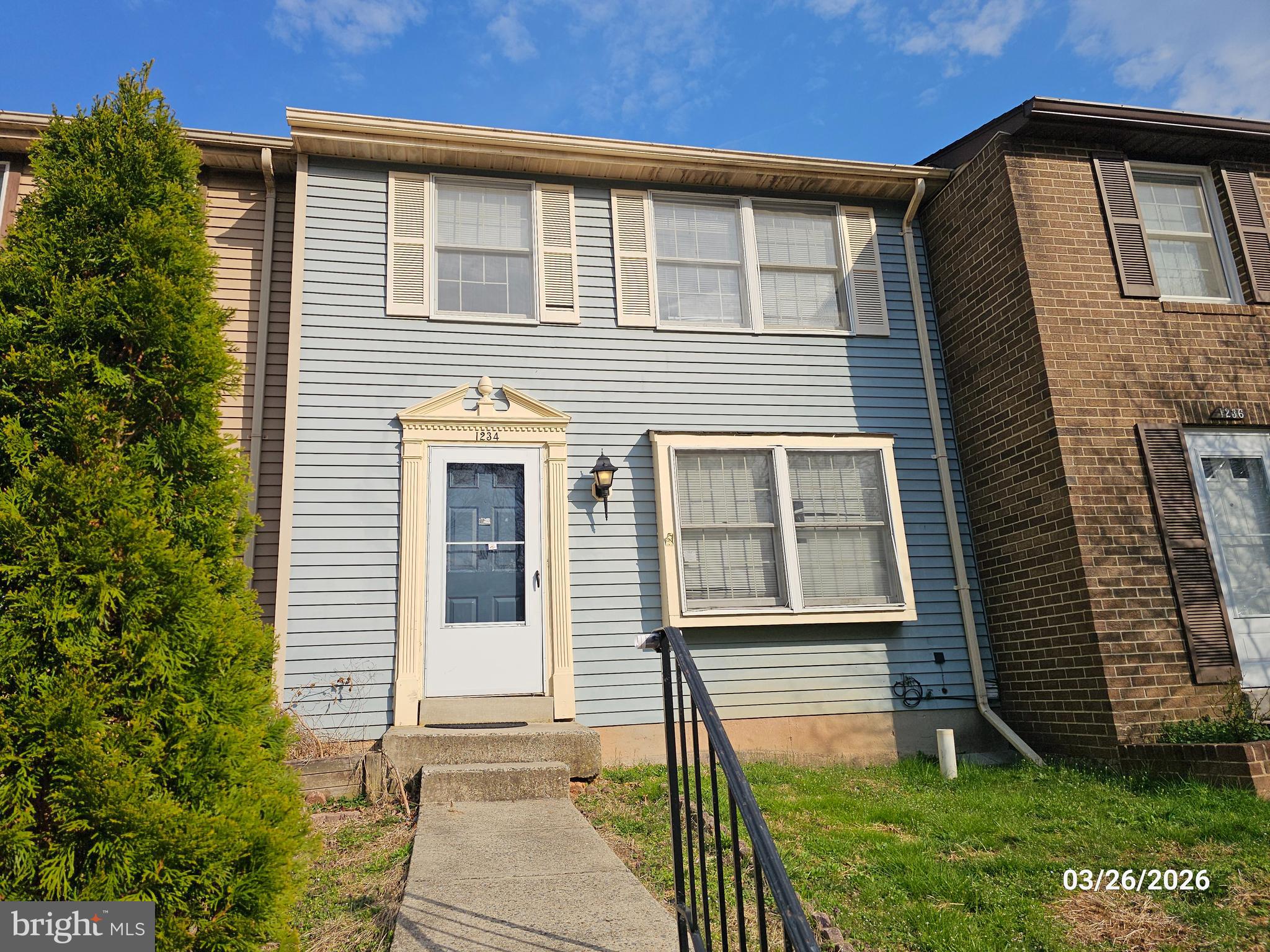 1234 Elm Grove Circle Silver Spring, MD 20905 - Photo 1 of 8 a front view of a house with a yard