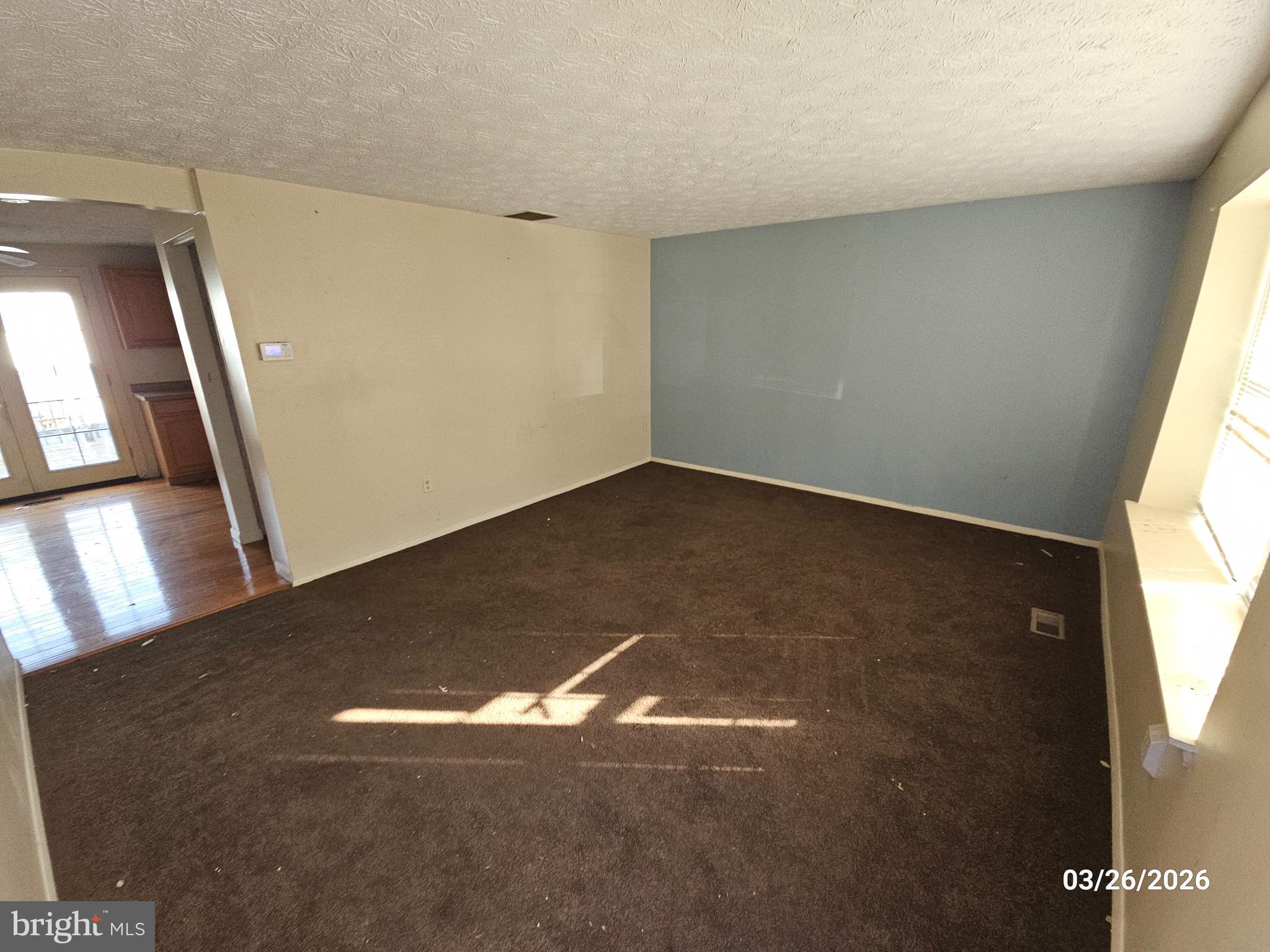 1234 Elm Grove Circle Silver Spring, MD 20905 - Photo 2 of 8 an empty room with a window