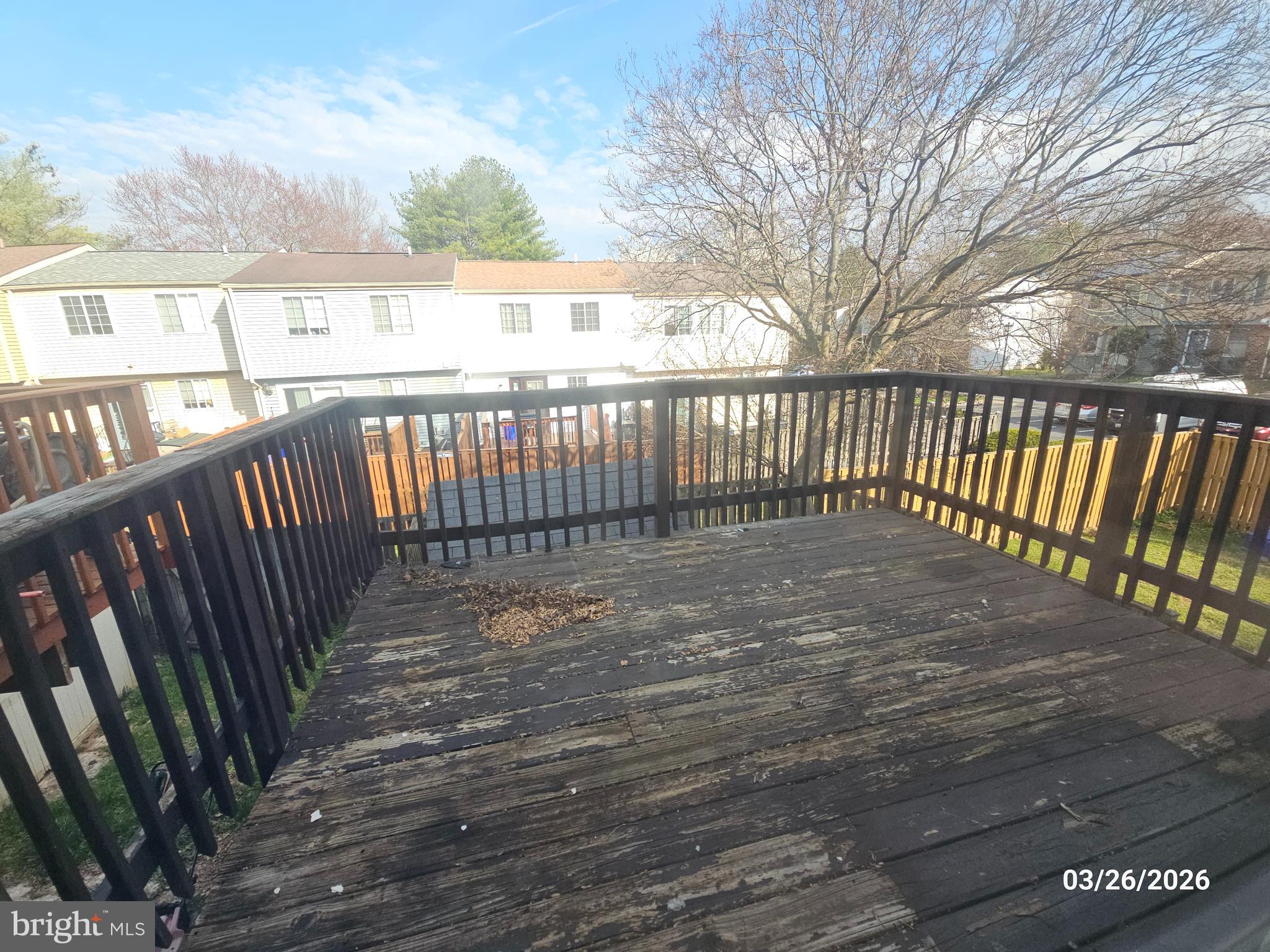 1234 Elm Grove Circle Silver Spring, MD 20905 - Photo 5 of 8 a view of a balcony with wooden floor
