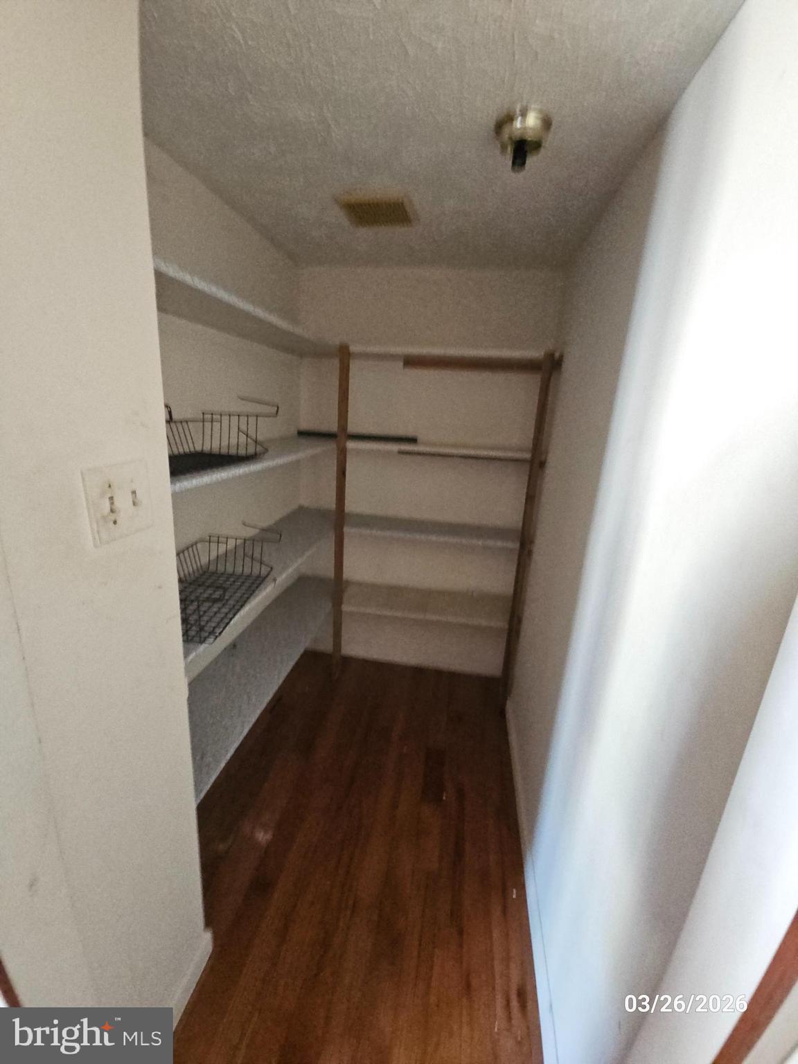 1234 Elm Grove Circle Silver Spring, MD 20905 - Photo 6 of 8 a view of walk in closet with empty racks