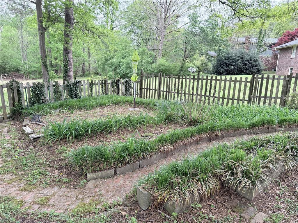 3033 Riviera Drive Conyers, GA 30012 - Photo 64 of 79 a view of a yard with large trees