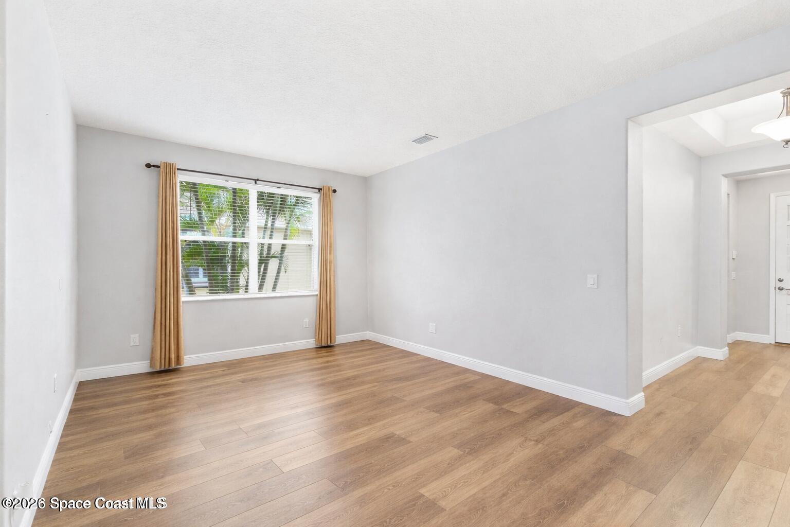 3283 Candia Drive Melbourne, FL 32940 - Photo 12 of 45 Living room shown vacant