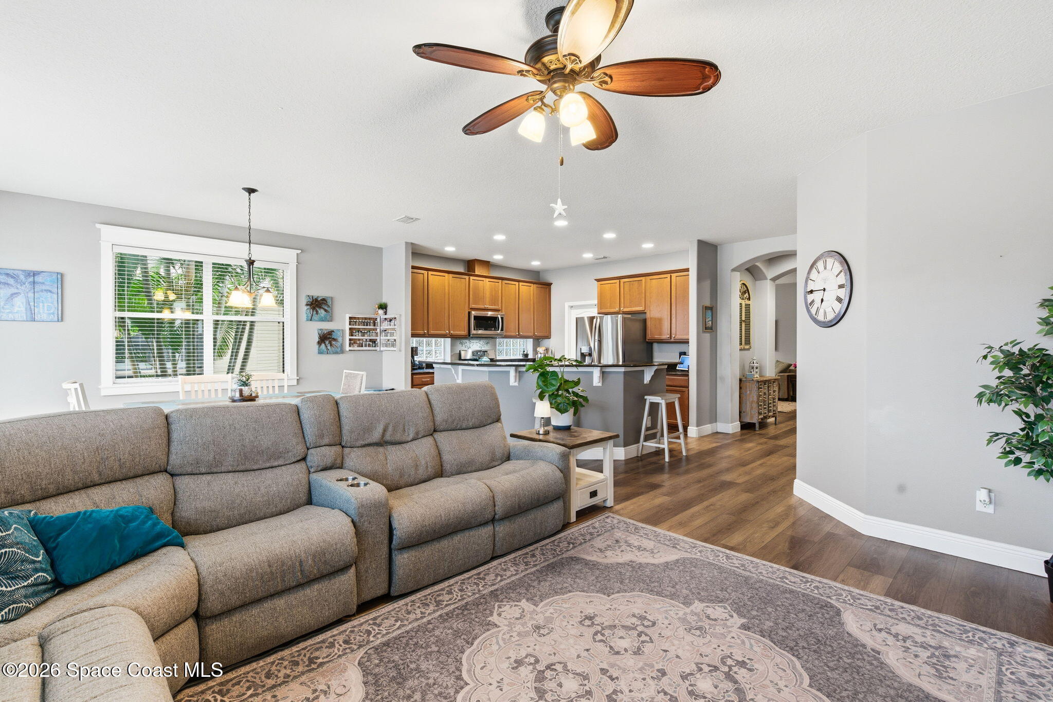 3283 Candia Drive Melbourne, FL 32940 - Photo 20 of 45 a living room with furniture kitchen view and a large window