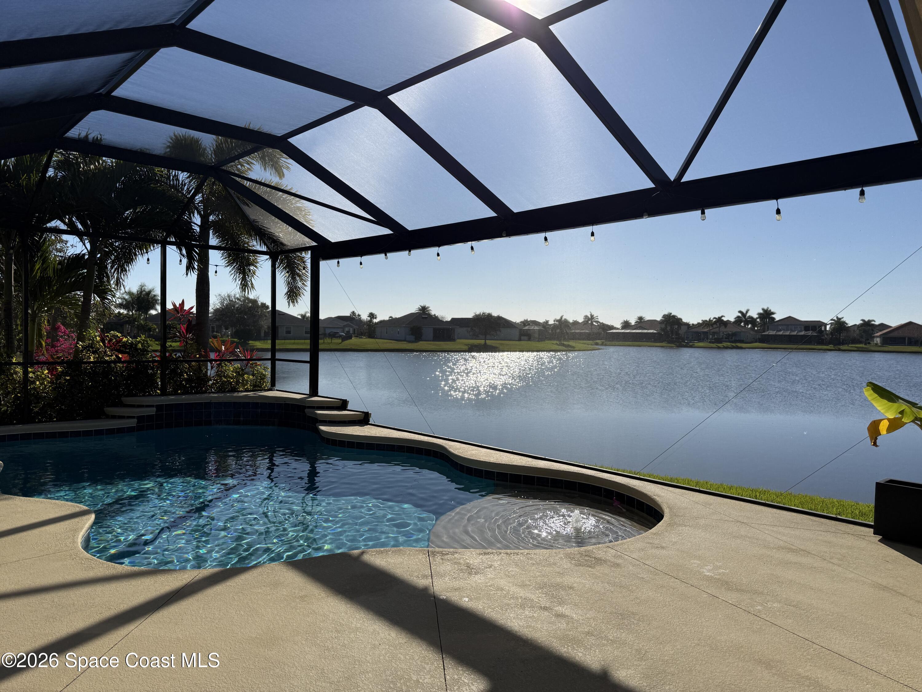 3283 Candia Drive Melbourne, FL 32940 - Photo 2 of 13 Screened in salt water pool