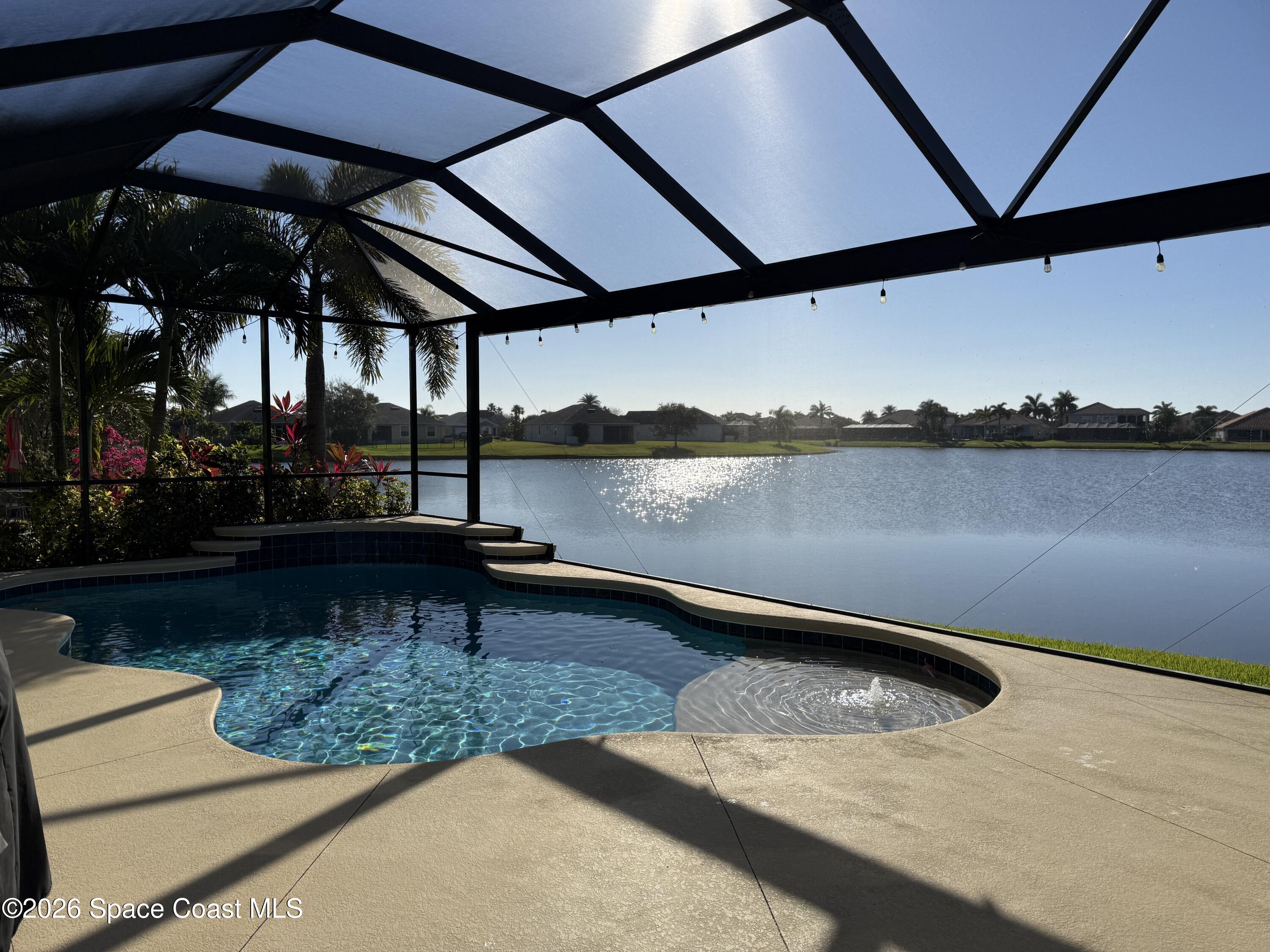 3283 Candia Drive Melbourne, FL 32940 - Photo 3 of 13 Screened in salt water pool