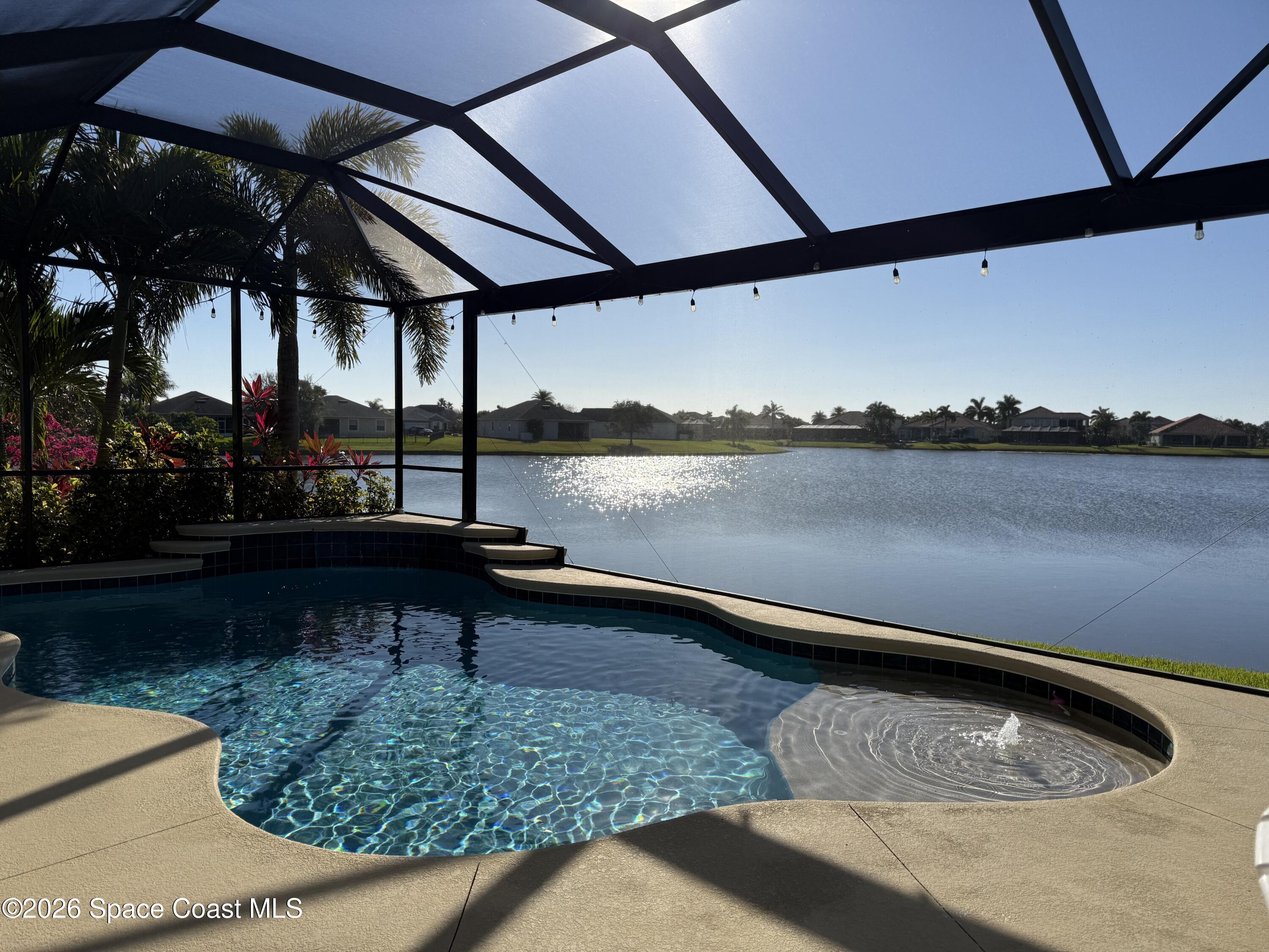 3283 Candia Drive Melbourne, FL 32940 - Photo 9 of 13 Screened in salt water pool