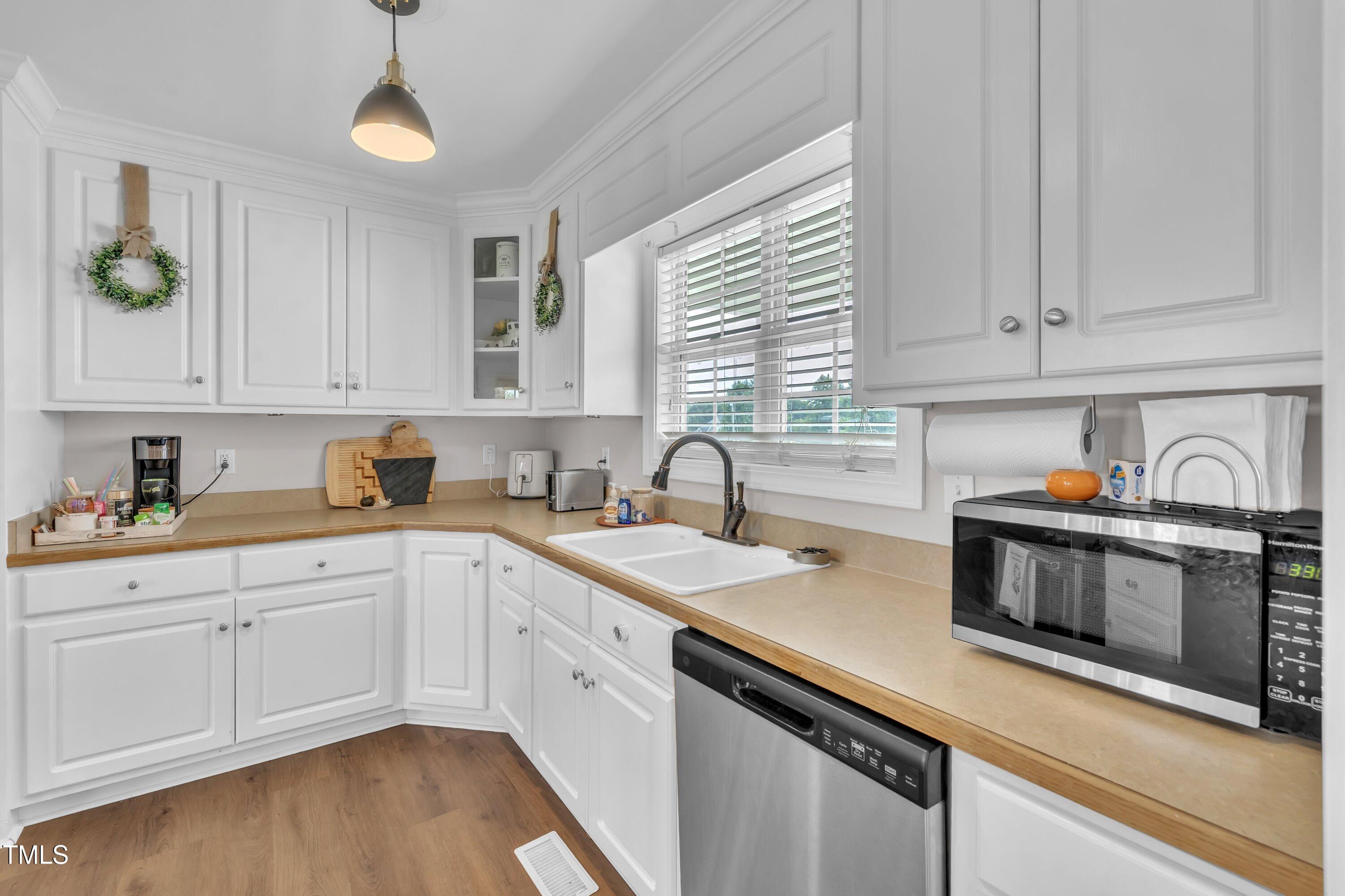 6953 Rock Ridge Sims Road Sims, NC 27880 - Photo 11 of 29 a kitchen with sink cabinets and stainless steel appliances