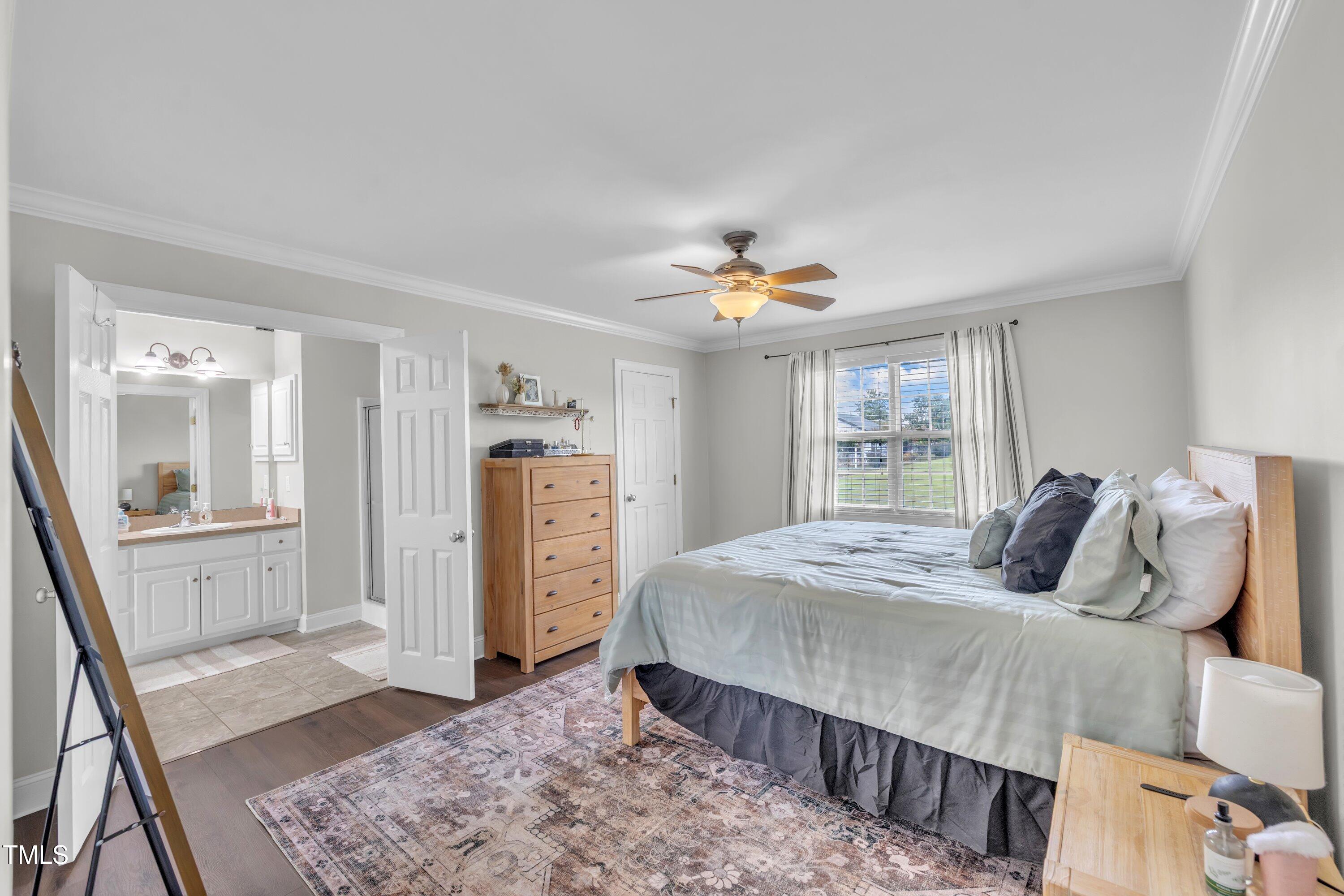 6953 Rock Ridge Sims Road Sims, NC 27880 - Photo 15 of 29 a bedroom with a bed and wooden floor