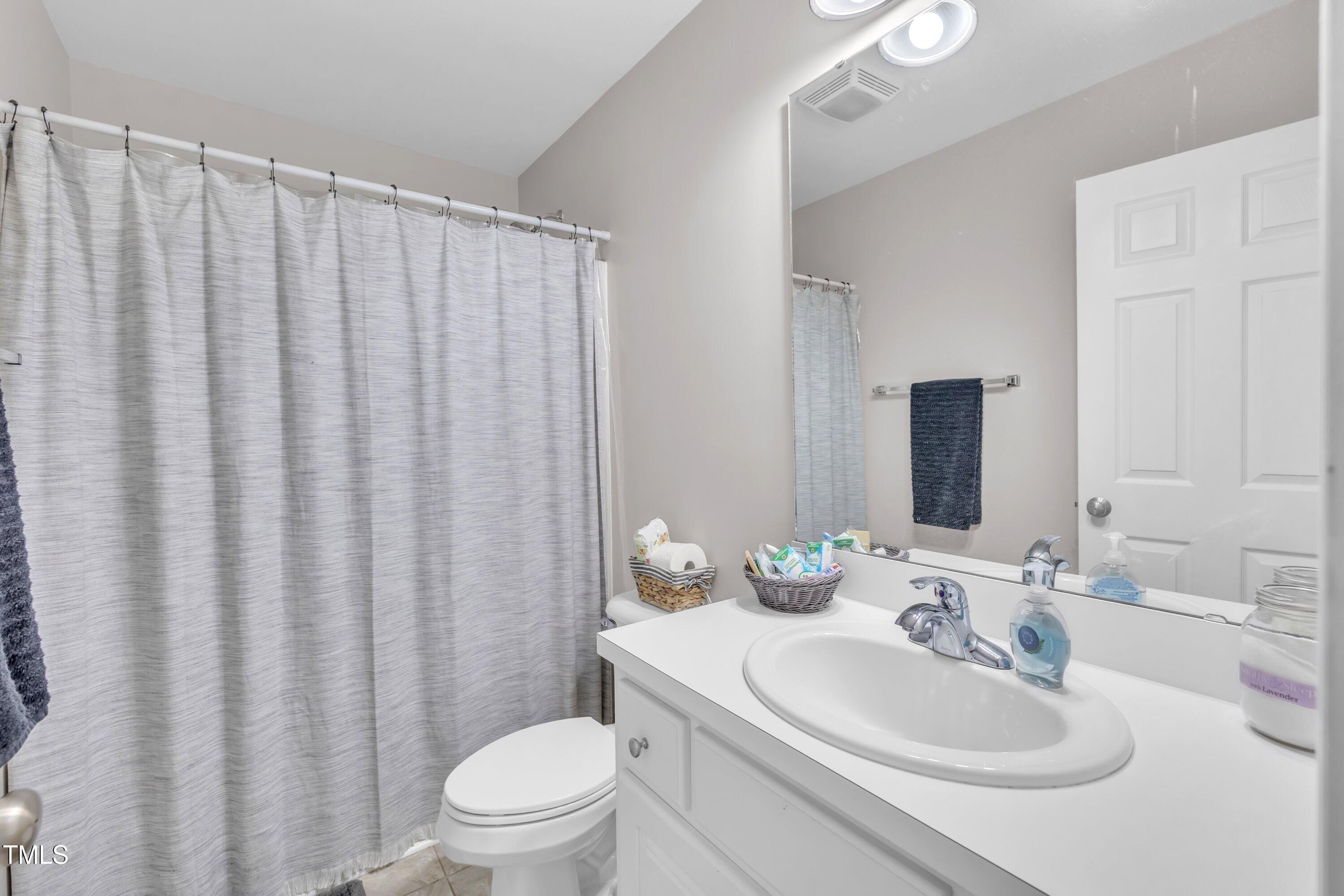 6953 Rock Ridge Sims Road Sims, NC 27880 - Photo 23 of 29 a bathroom with a sink toilet and shower