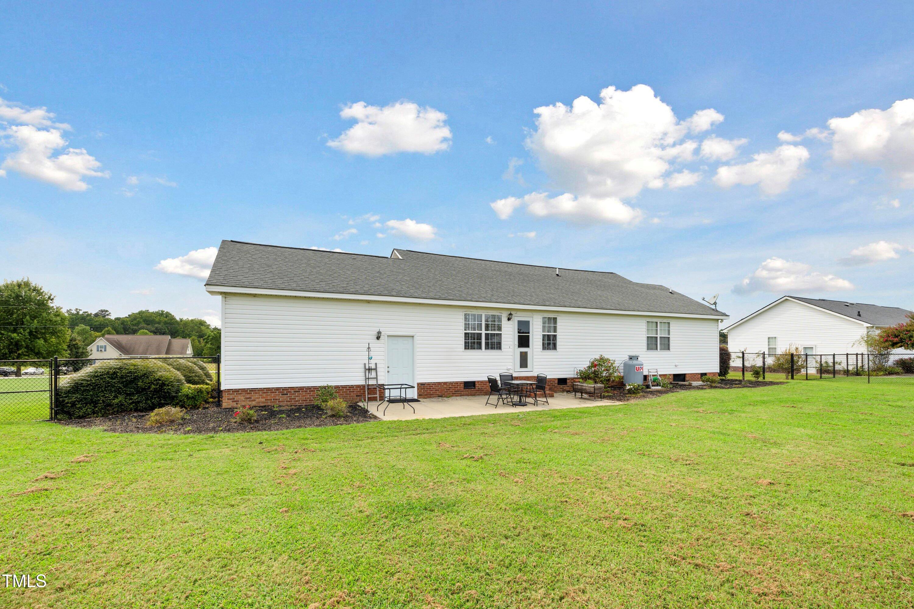 6953 Rock Ridge Sims Road Sims, NC 27880 - Photo 25 of 29 a front view of house with yard and green space