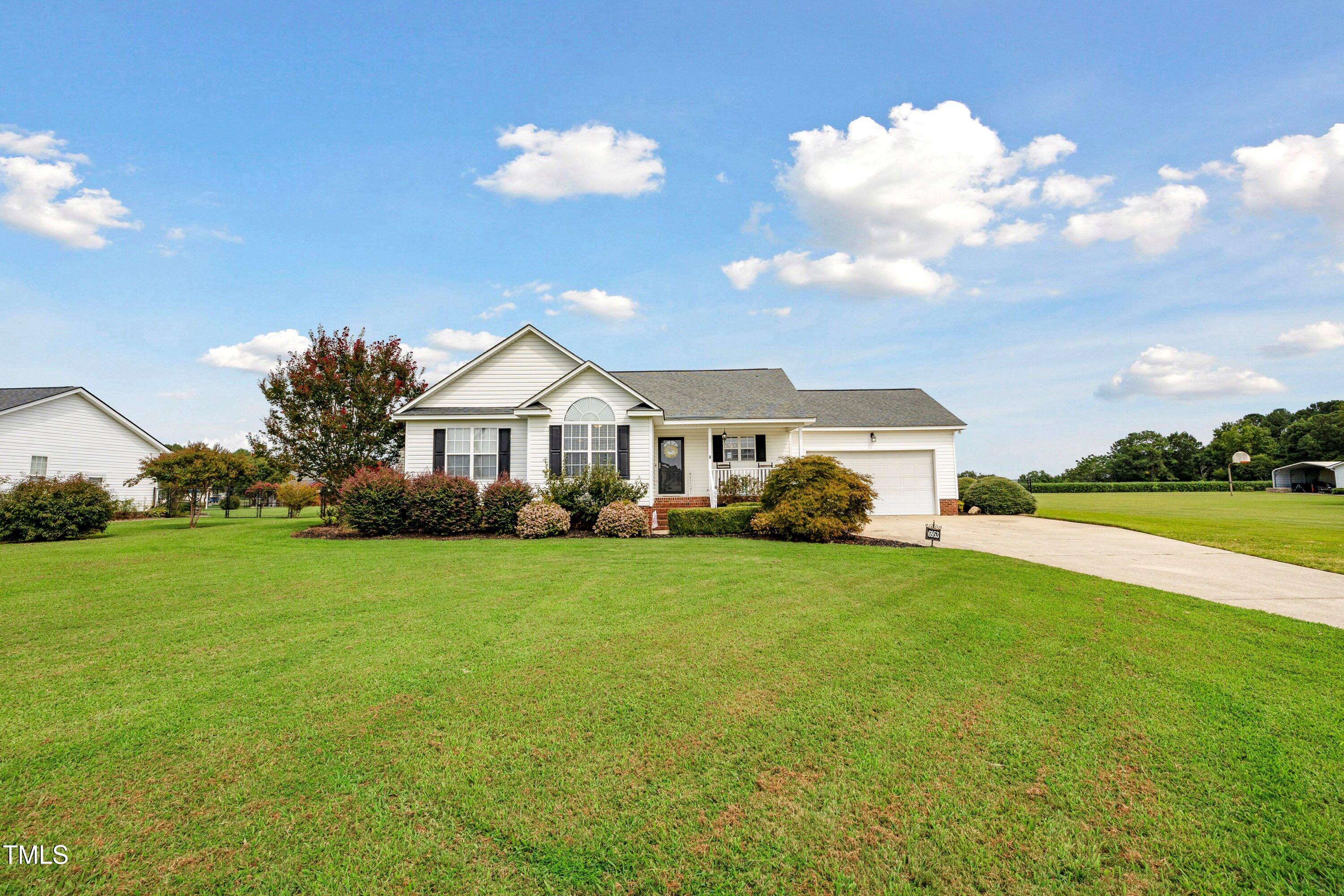 6953 Rock Ridge Sims Road Sims, NC 27880 - Photo 28 of 29 a front view of a house with garden