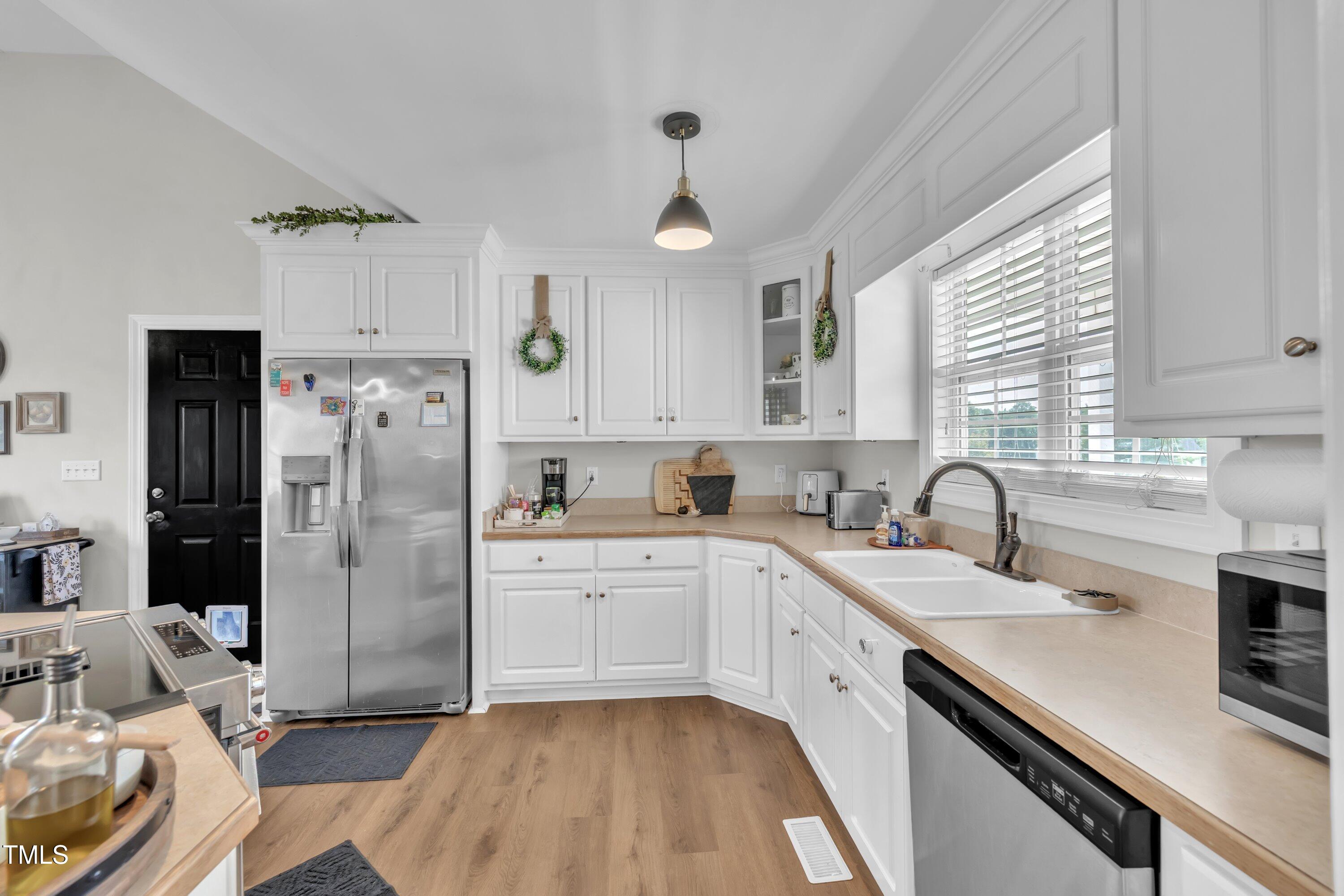 6953 Rock Ridge Sims Road Sims, NC 27880 - Photo 10 of 29 a kitchen with refrigerator cabinets and a sink