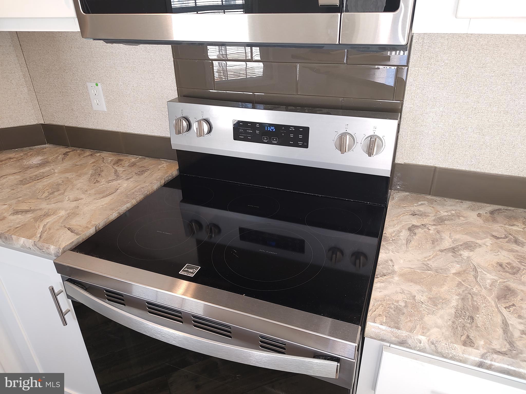 12623 Shell Mill Road, Unit 51 Bishopville, MD 21813 - Photo 20 of 41 a close view of stove