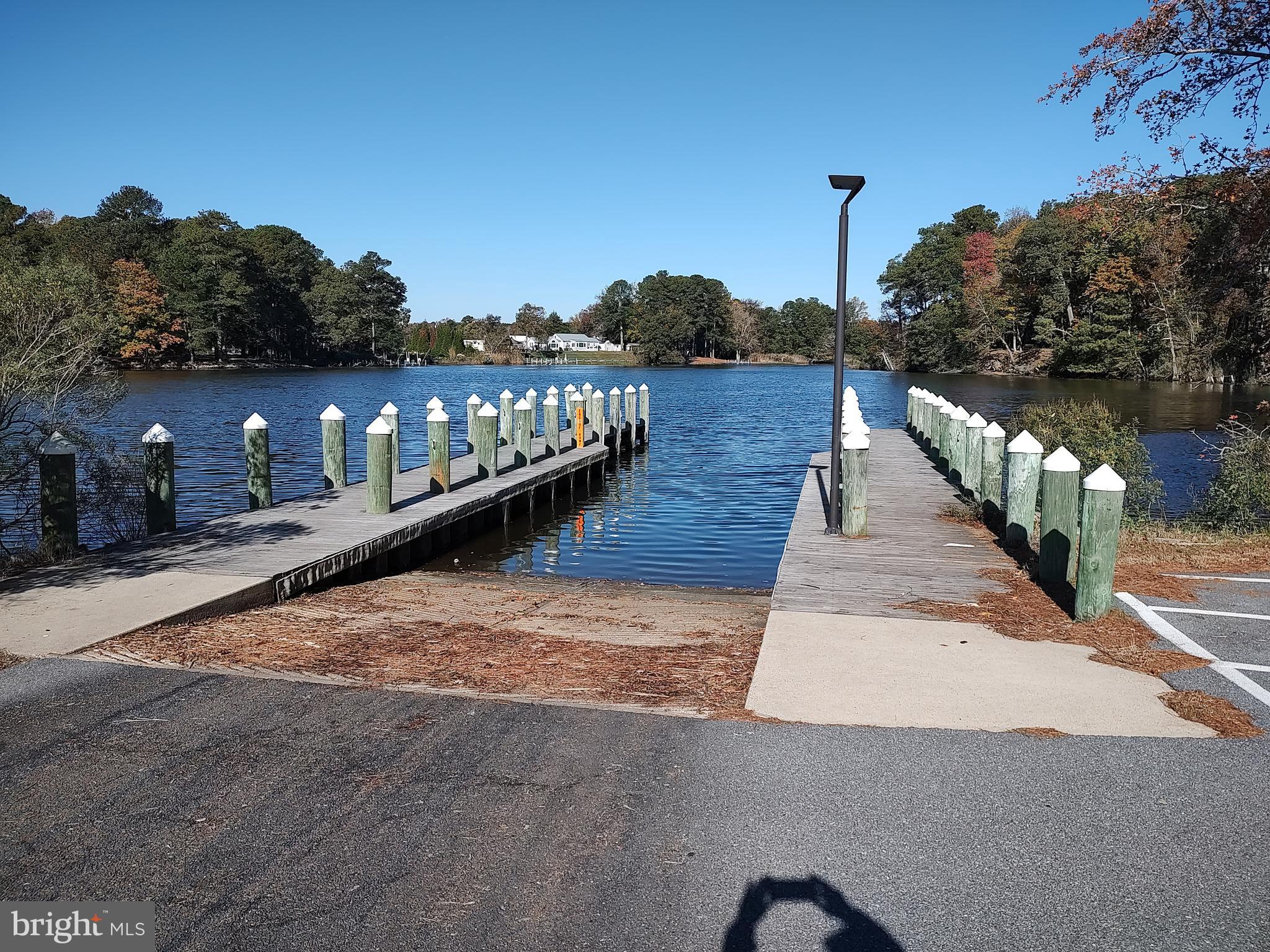 12623 Shell Mill Road, Unit 51 Bishopville, MD 21813 - Photo 2 of 41 a view of a balcony with wooden floor