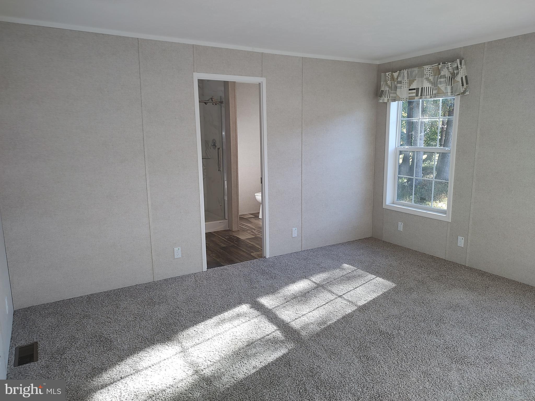 12623 Shell Mill Road, Unit 51 Bishopville, MD 21813 - Photo 26 of 41 an empty room with windows