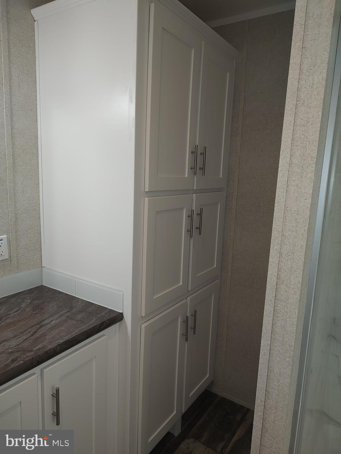 12623 Shell Mill Road, Unit 51 Bishopville, MD 21813 - Photo 34 of 41 a view of storage and utility room with empty racks