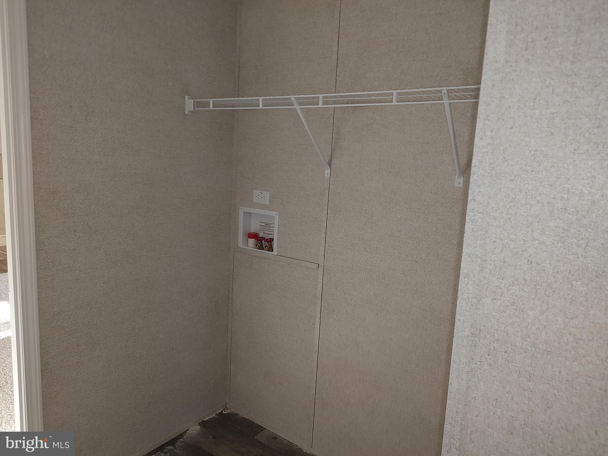 12623 Shell Mill Road, Unit 51 Bishopville, MD 21813 - Photo 39 of 41 a view of a room with racks on the wall