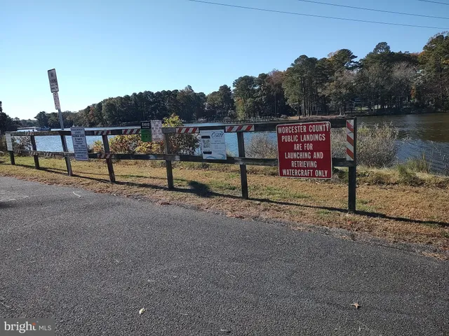 a view of a park with iron fence