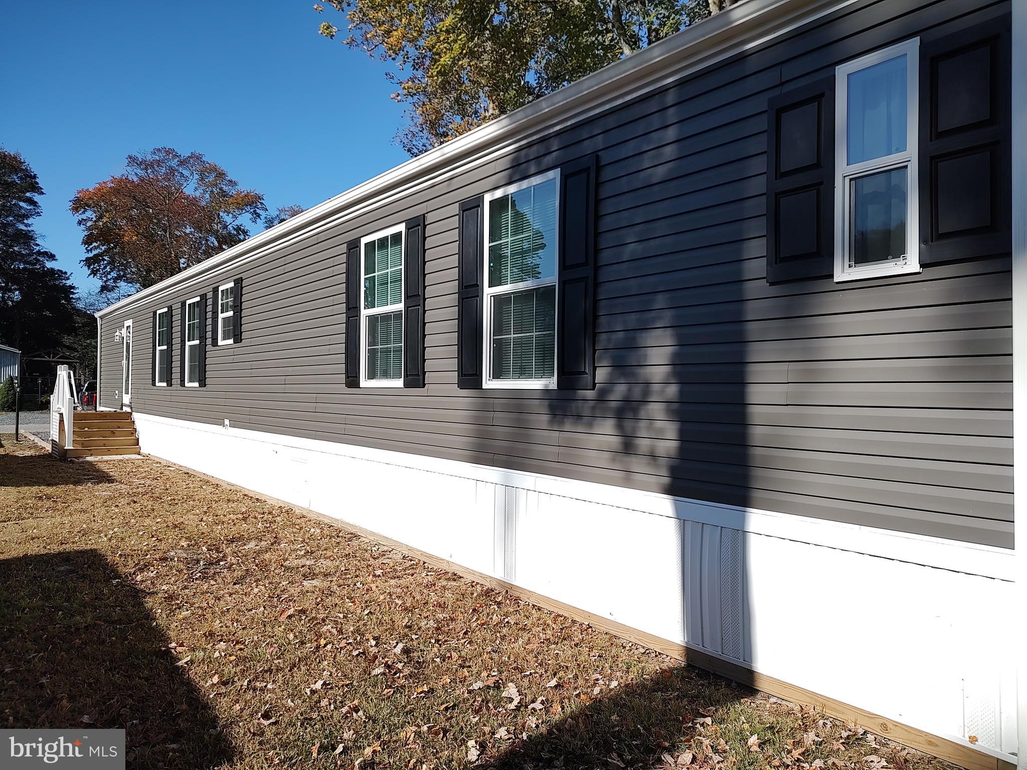 12623 Shell Mill Road, Unit 51 Bishopville, MD 21813 - Photo 8 of 41 a view of a house with snow on the road