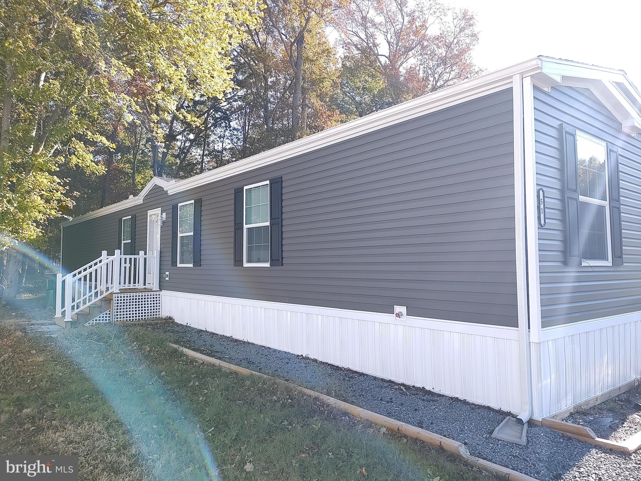 12623 Shell Mill Road, Unit 51 Bishopville, MD 21813 - Photo 9 of 41 a backyard of a house